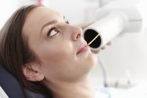 Closeup of beautiful female patient at dentist office